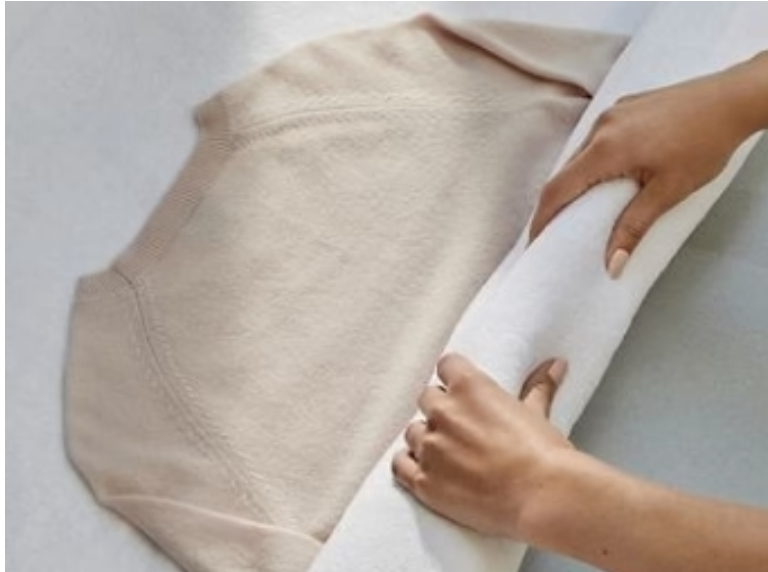 01. Roll your cashmere in a clean towel to squeeze the excess water out prior to laying flat.